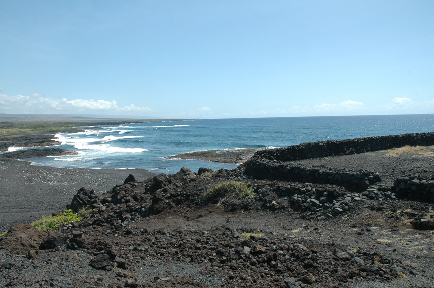 Nīnole looking towards Punalu‘u.  The homesite and birthplace of  ‘Ōpūkaha‘ia is located several coves north of this black sand beach.